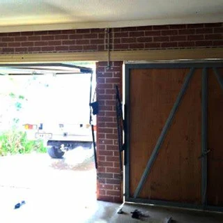 Garage door tip-up hinges
