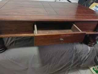 Antique table with draws can be used as a TV stand