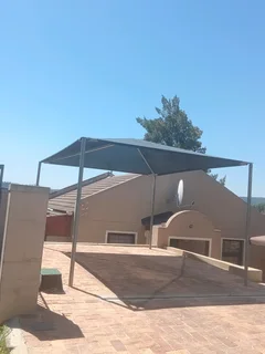 We do SHADEPORTS and CARPORTS STRUCTURES Call or WhatsApp 069 912 9265