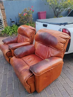 2 genuine leather recliner couches, used
