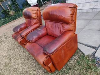 2 genuine leather recliner couches, used