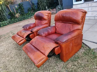 2 genuine leather recliner couches, used