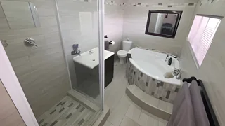 Immaculate 3 bedroom, two bathroom house with a bachelors flat.