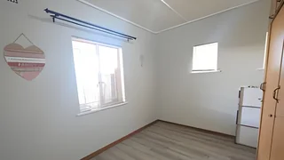 Immaculate 3 bedroom, two bathroom house with a bachelors flat.