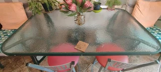 1x1.5 meter glass table with 6 chairs, cushioning all inclusive for R1500. Not brand new but in well
