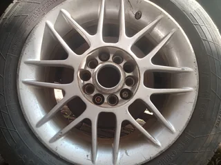 A set of 4 15inch rims and they come with tires.  Second hand but in good condition