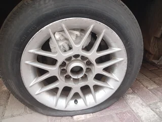 A set of 4 15inch rims and they come with tires.  Second hand but in good condition