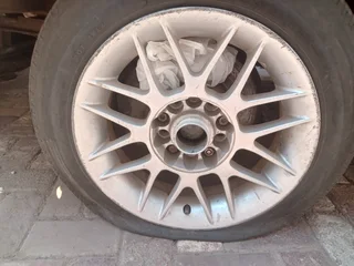 A set of 4 15inch rims and they come with tires.  Second hand but in good condition