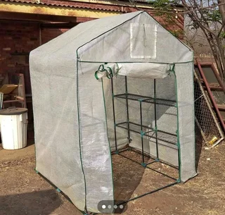 Green house with shelving .