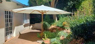 Sunshade 4m dia, foldable, complete with stable base. Also a protective cover for use when closed.