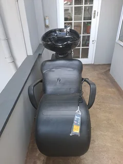 Massage chair and hair wash station. R6000