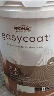 More than half bucket of white paint