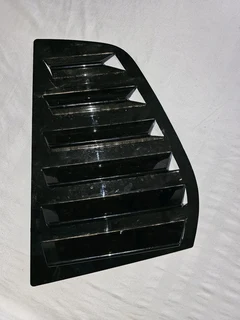 A Rear window louver for a car, VW Golf.