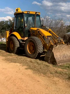 JCB 1 cx and Cat 226 skid steer loader for sale as a package