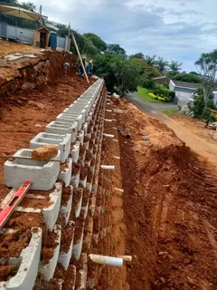 We do retaining walls tar driveway resurfacing concrete paving building renovations roofing