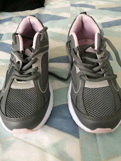 one pair of ladies sneakers size five