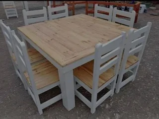 8 seater dinning table with 8 chairs available