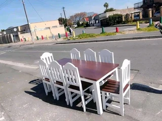 10 seater dinning table and chairs available