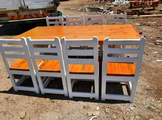 8 seater dinning table with 8 chairs available