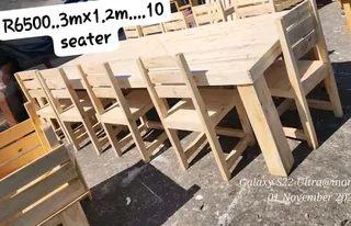 12 seater stunning dining table with chairs available for cash on delivery