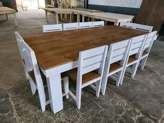 12 seater stunning dining table with chairs available for cash on delivery
