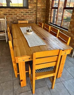 12 seater stunning dining table with chairs available for cash on delivery