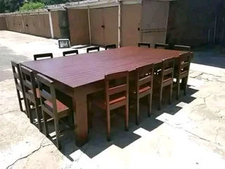 12 seater stunning dining table with chairs available for cash on delivery