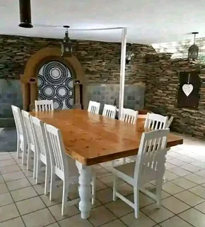 10 seater stunning dining table with chairs available for cash on delivery we charge extra delivery