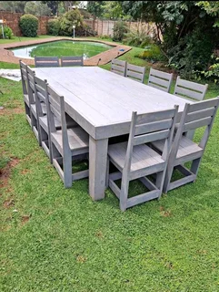 12 seater stunning dining table with chairs available for cash on delivery