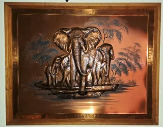 Framed dimensional wall art of African elephants.