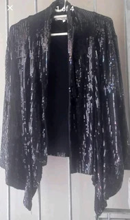 Ladies black sequined cocktail jacket. Will fit size 12/14/16