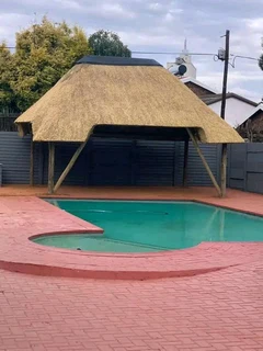 Swimming pools and thatching grass