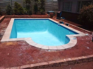 Swimming pools and thatching grass