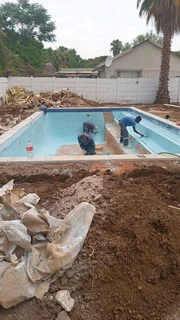 Swimming pools and thatching grass