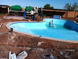 Swimming pools and thatching grass