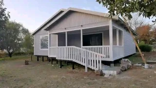 Log Home 10m×8m plus 4m×2m Balcony with 2 Bedrooms, 1 Bathroom, Open plan Kitchen area and Lounge.