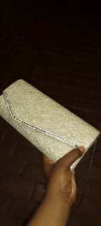 Golden sparkly clutch bag