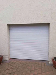 GARAGE DOORS INSTALLATIONS AND AUTOMATIONS