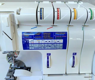 ELNA 745 5trade over locker in excellent condition as NEW