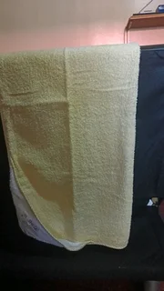 Used yellow baby towel