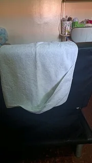 Used white hooded baby towel