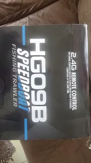 RC Speedboat and fishing trailer with line release. Brand new. Still sealed in original packaging.