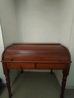 Cherry wood Roller top desk with chair, crafted by Adam Bede. Leather slide out dest top R8800