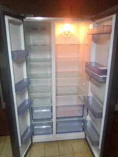 LIKE NEW DEFY SIDE BY SIDE STAINLESS STEEL FRIDGE