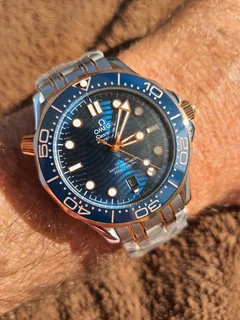 Omega Seamaster Professional 300m Mens Two Tone Automatic Watch Blue sunburst wave dial