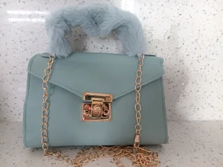 Green handbag in stock