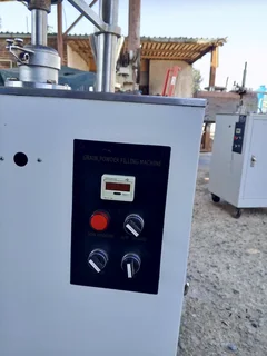 VOLUMETRIC FILLER SEMI AUTOMATIC