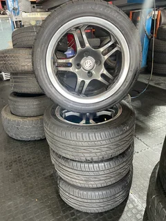 A Clean set of 15inch rims and Tyres pcd 4/100 available for sale