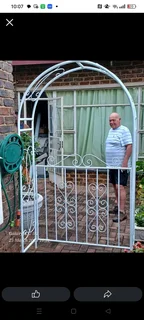 garden arbor or trellis with a gate