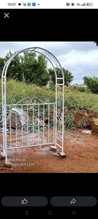 garden arbor or trellis with a gate